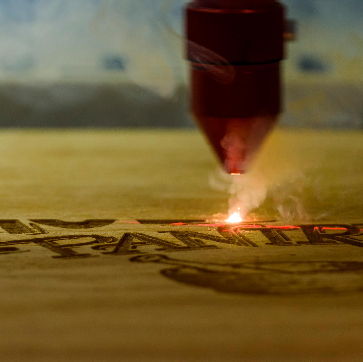Laser etching logo onto plywood