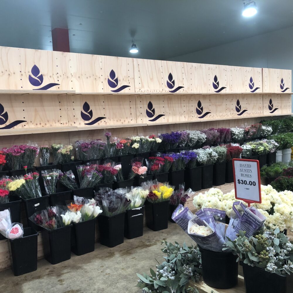 Tony's Wholesale Flowers Engraved Logo Wall and bins