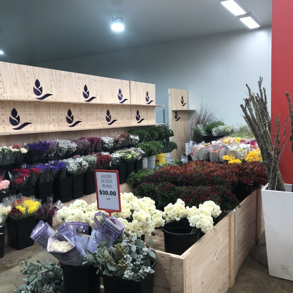 Tony's Wholesale Flowers Engraved Logo Wall and bins