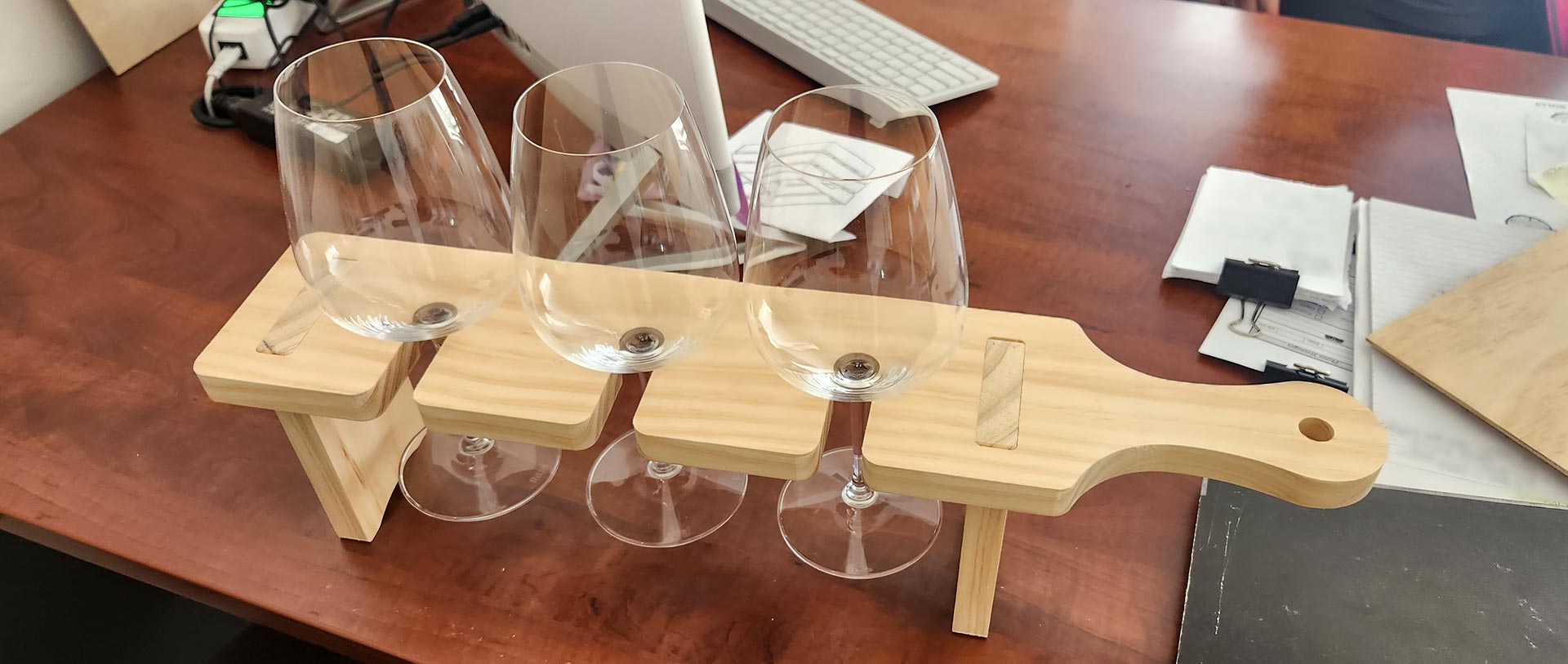Wine tasting paddle populated with three glasses